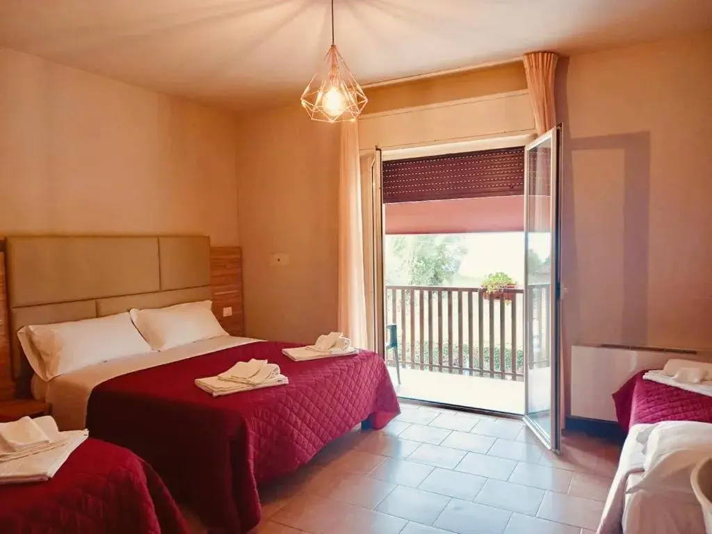 Quadruple Room with Balcony in Hotel Torricella Quadruple Room with Balcony in Hotel Torricella