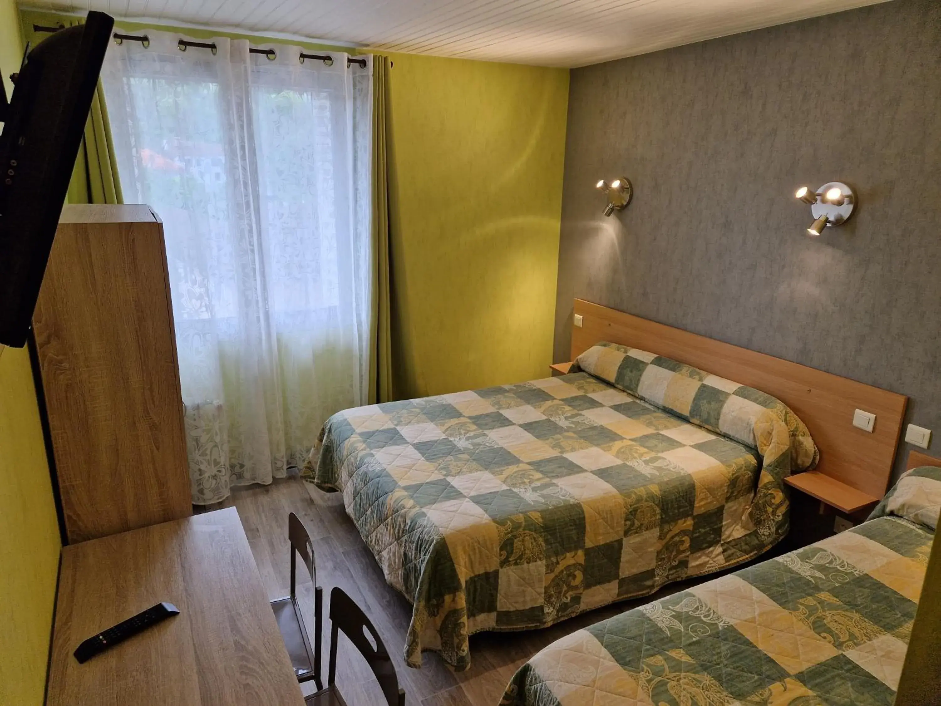 Triple Room (Street Side) in Le Faubourg Triple Room (Street Side) in Le Faubourg