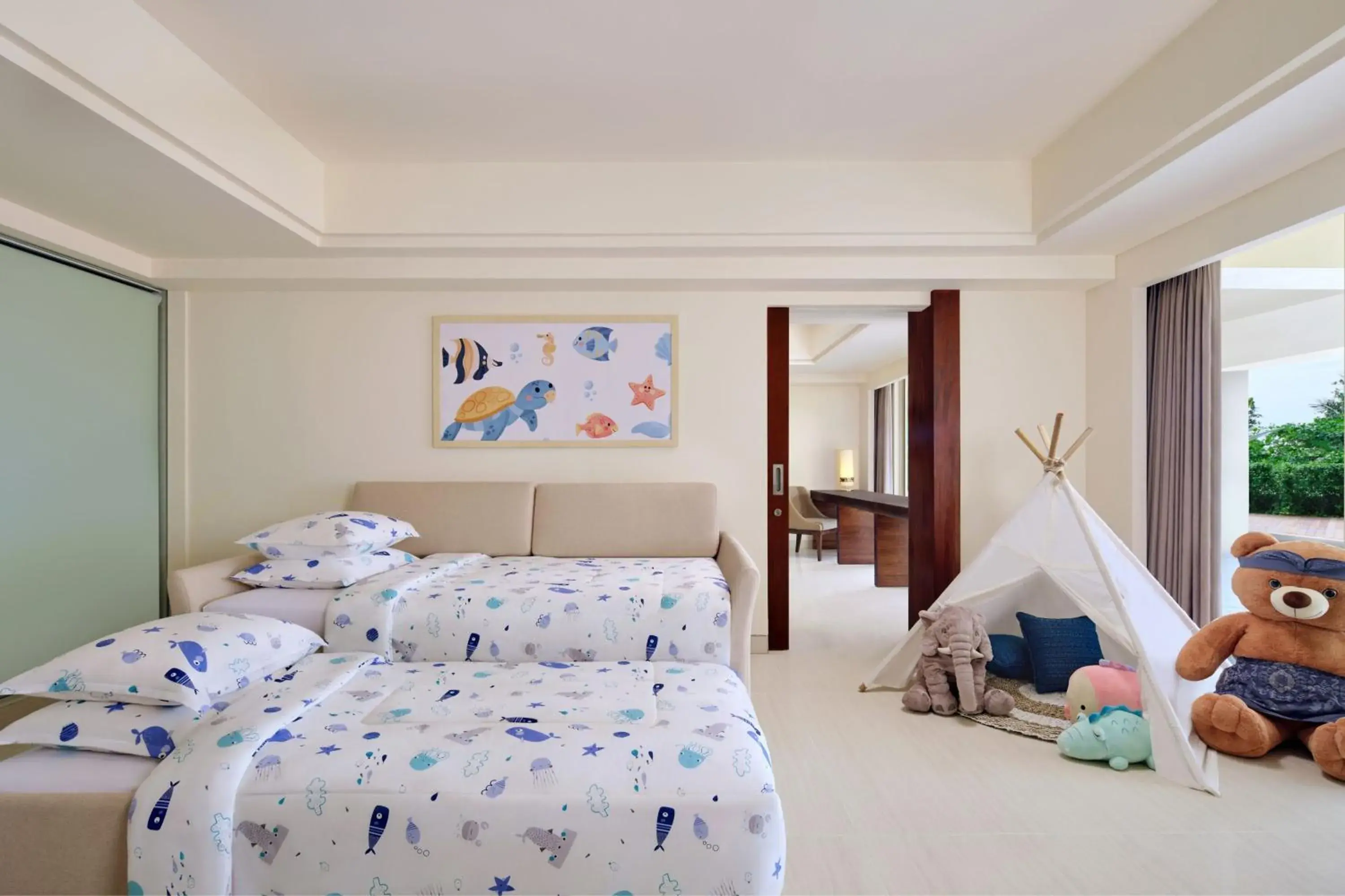 Junior Family Suite, Garden View, 1 King Bed & 1 Sofa Bed (perfect for 2 adults & 2 children below 12 y.o.) in Sheraton Bali Kuta Resort Junior Family Suite, Garden View, 1 King Bed & 1 Sofa Bed (perfect for 2 adults & 2 children below 12 y.o.) in Sheraton Bali Kuta Resort