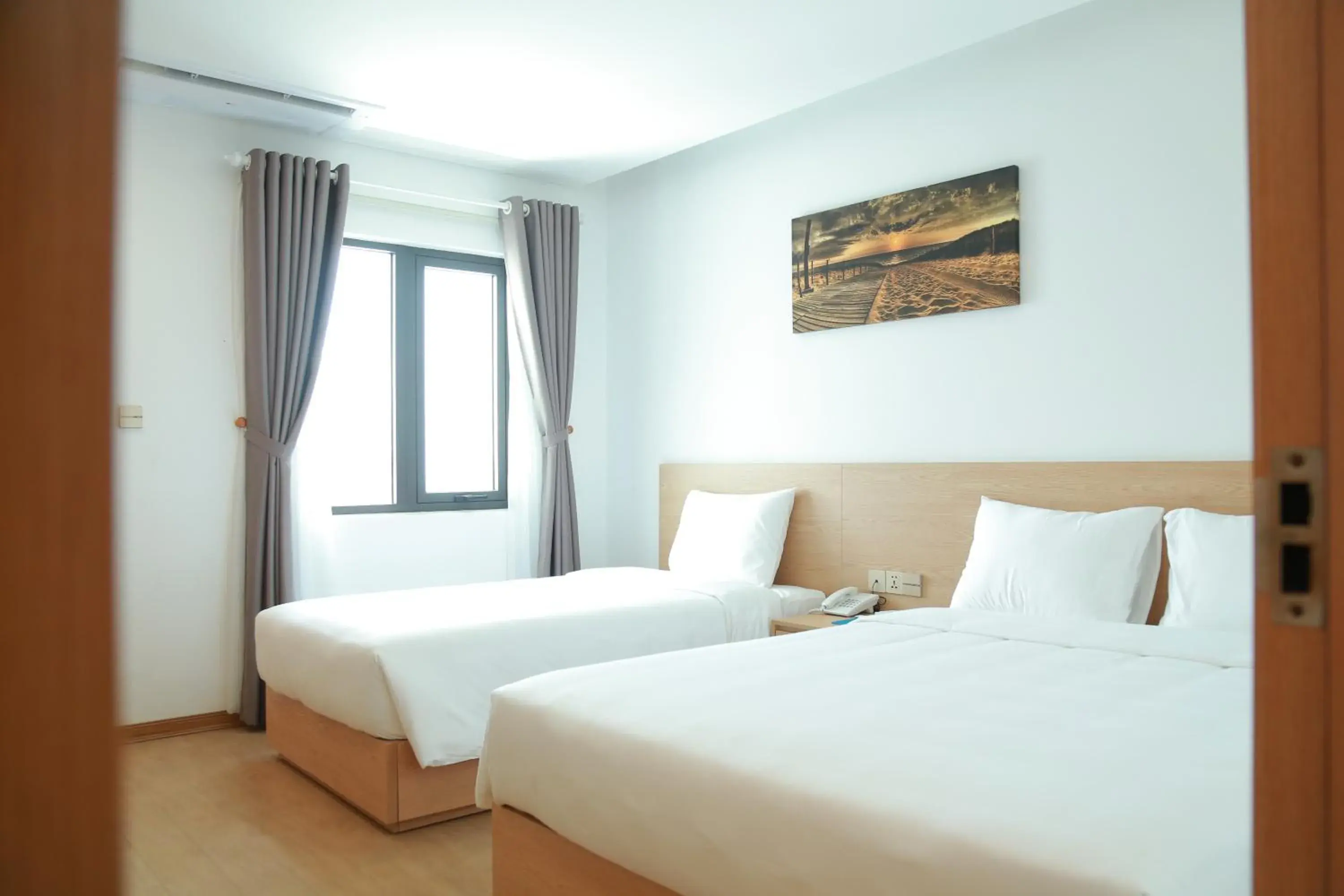 Triple Room with City View in Gold Boutique Hotel Danang Triple Room with City View in Gold Boutique Hotel Danang