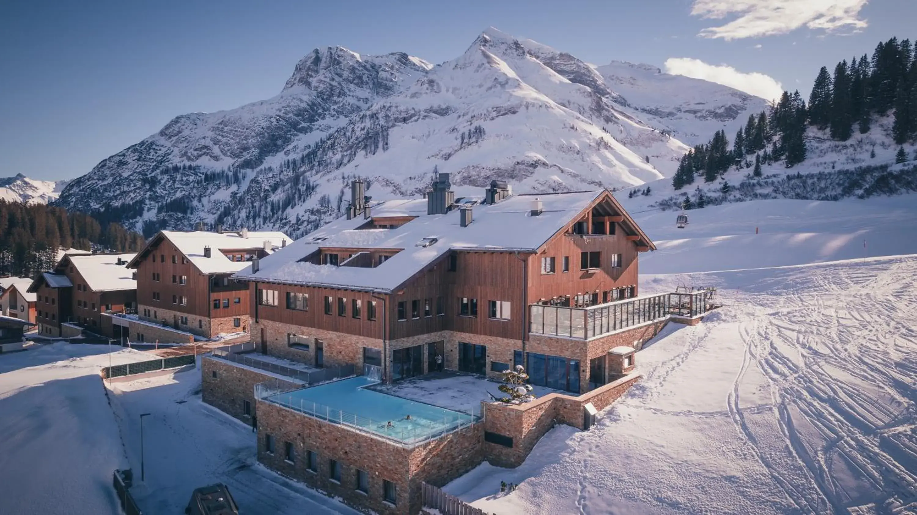 Property building in AlpenParks Hotel & Apartment Arlberg Warth mit Pool Property building in AlpenParks Hotel & Apartment Arlberg Warth mit Pool