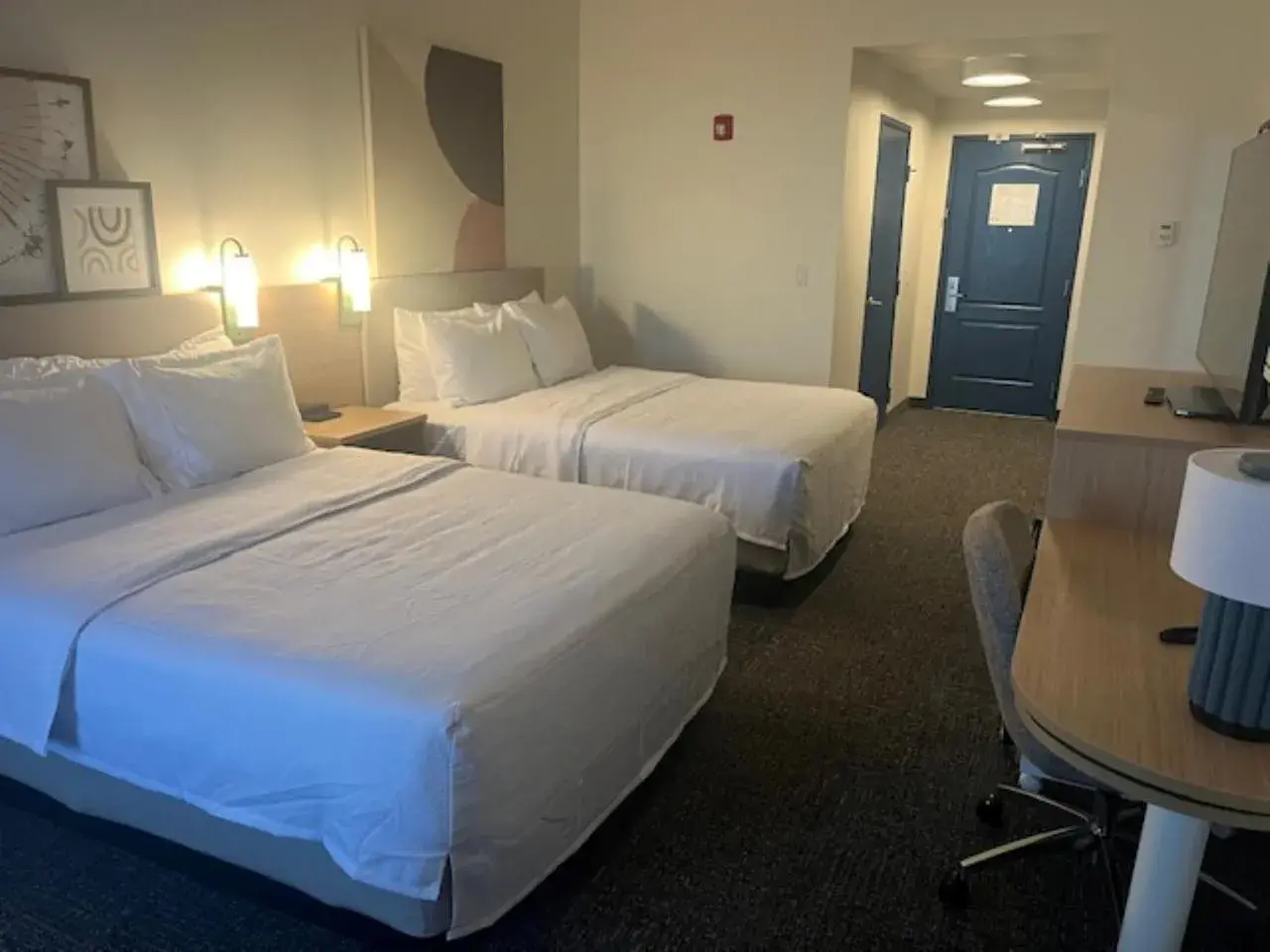 Queen Room with Two Queen Beds and Mobility Accessible Tub in Legacy Inn & Suites Queen Room with Two Queen Beds and Mobility Accessible Tub in Legacy Inn & Suites