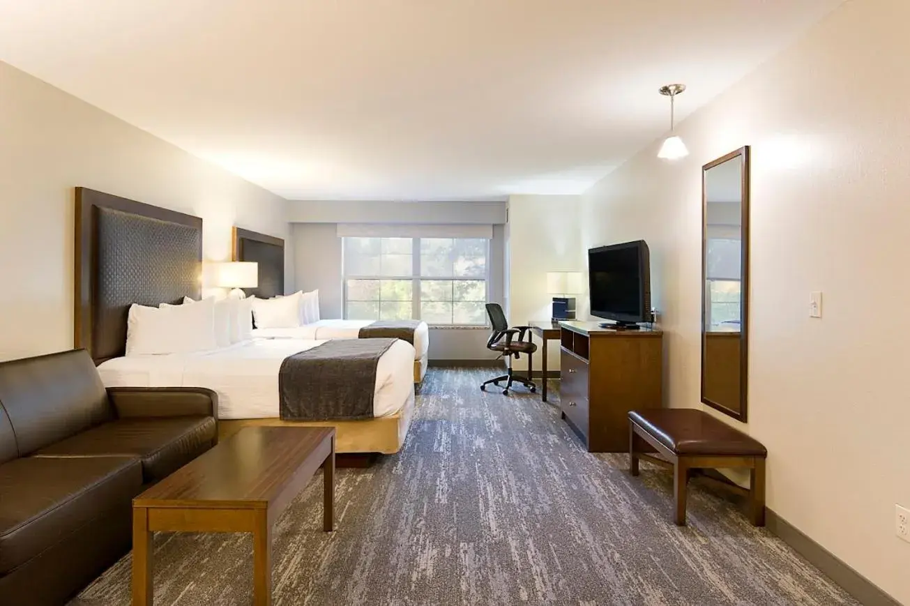 Deluxe Queen Room with Two Queen Beds in ClubHouse Hotel and Suites Deluxe Queen Room with Two Queen Beds in ClubHouse Hotel and Suites