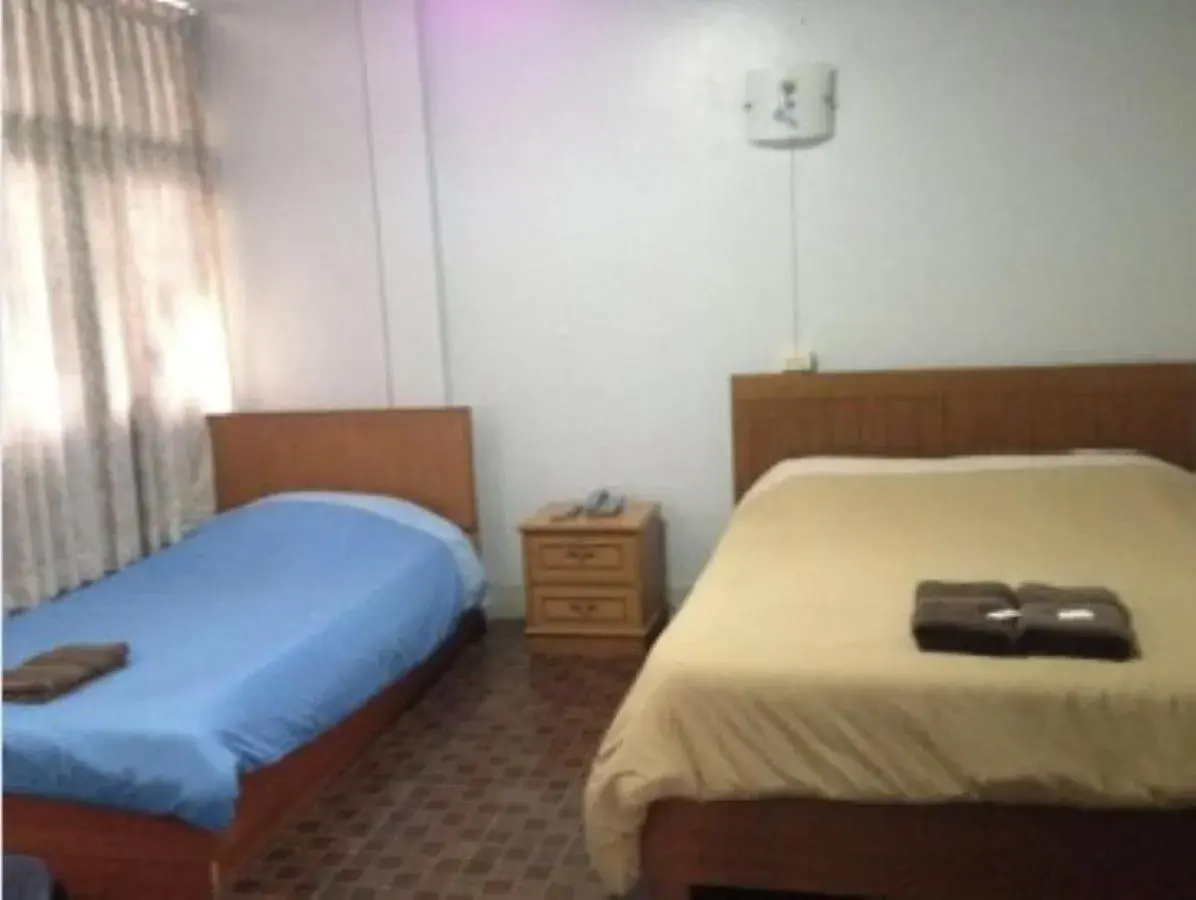 Triple Room in White Orchid Inn I Triple Room in White Orchid Inn I