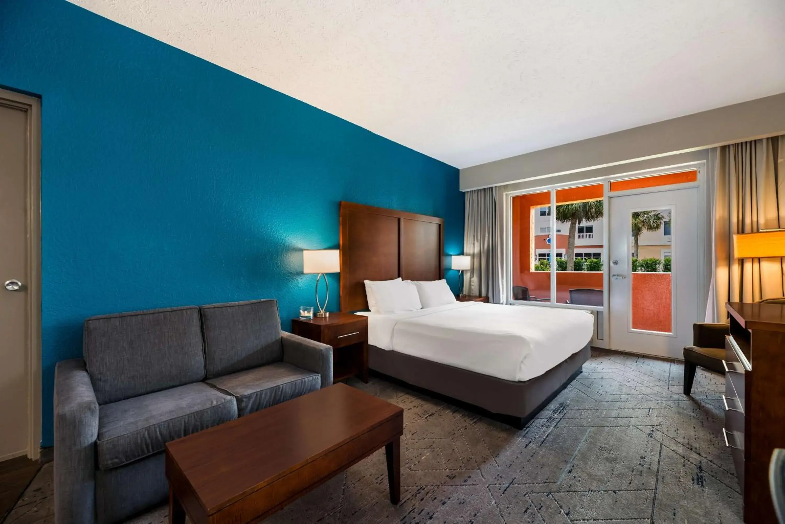 King Room with Sofa Bed and Balcony in SureStay Plus Hotel by Best Western The Villages King Room with Sofa Bed and Balcony in SureStay Plus Hotel by Best Western The Villages