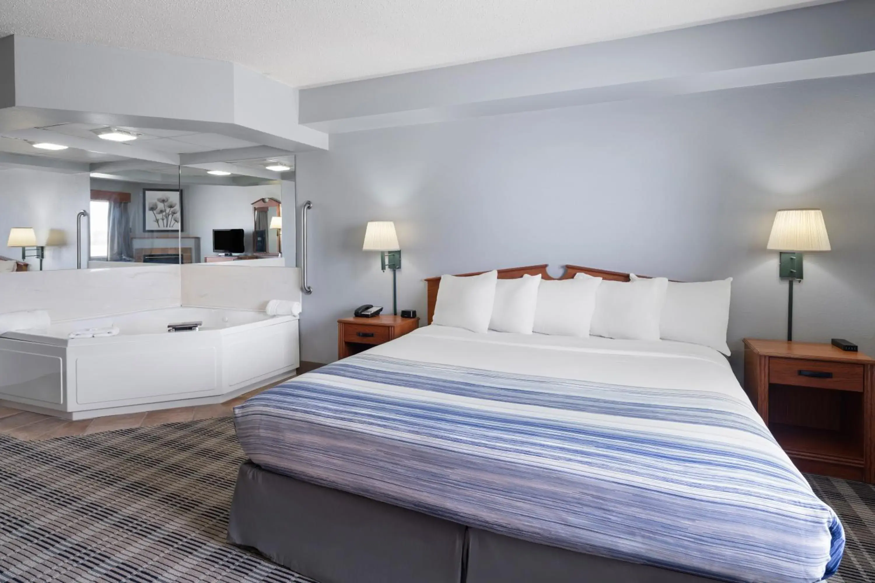 King Suite with Jetted Tub and Fireplace - Non-Smoking in AmericInn by Wyndham Stuart King Suite with Jetted Tub and Fireplace - Non-Smoking in AmericInn by Wyndham Stuart