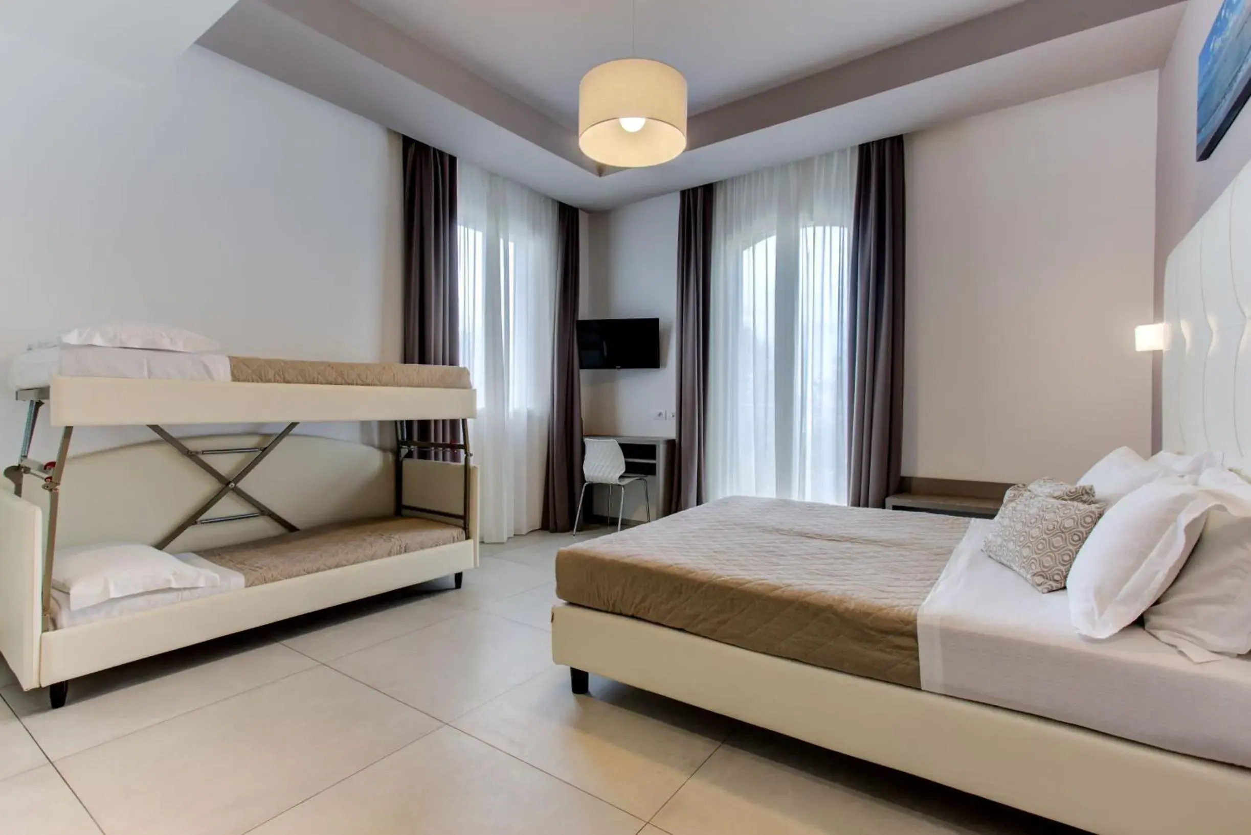 Quadruple Room in Hotel Villa Augustea Quadruple Room in Hotel Villa Augustea