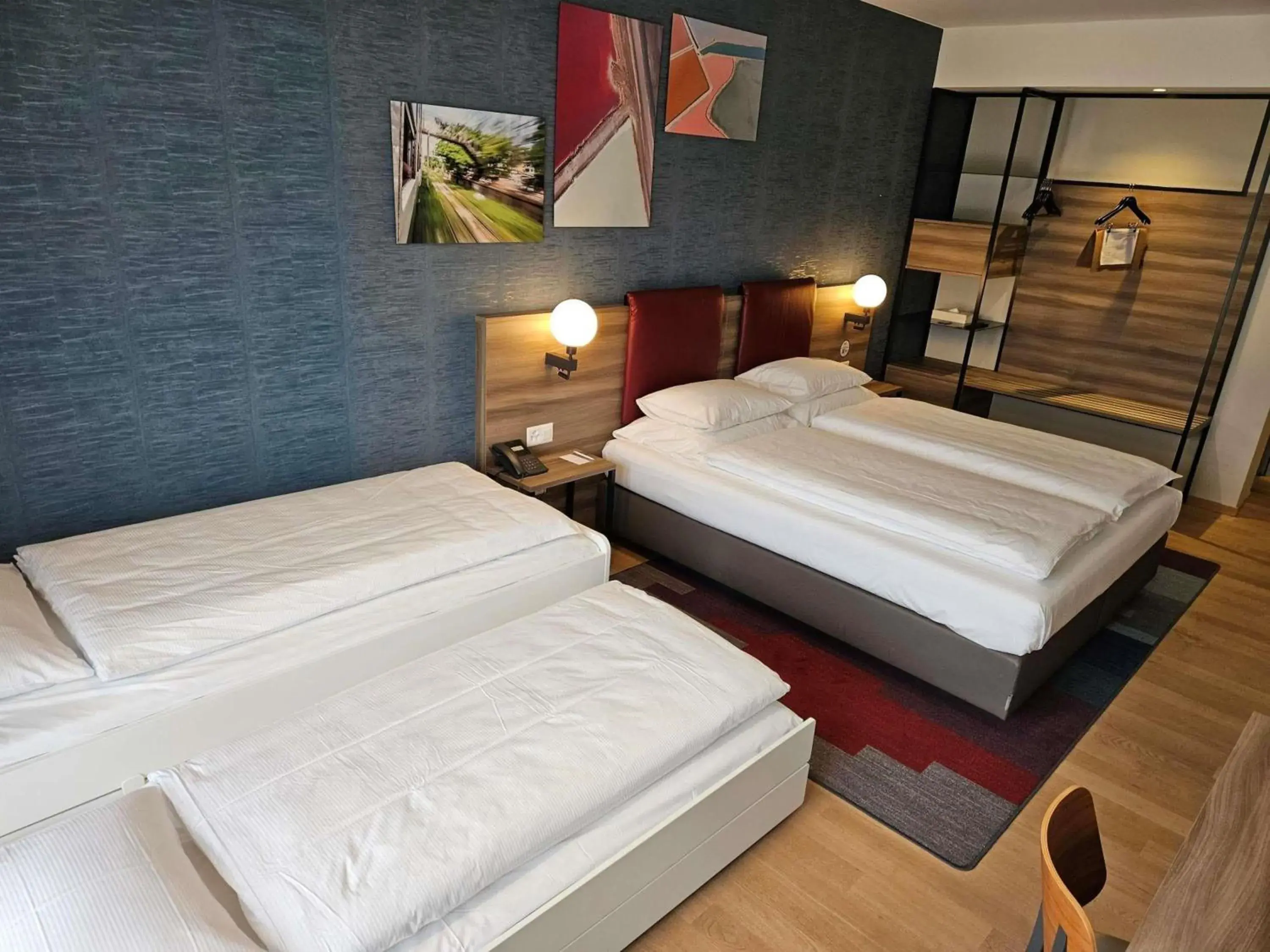 Family room with one double bed and one extra bed in Mercure Geneva Airport Family room with one double bed and one extra bed in Mercure Geneva Airport