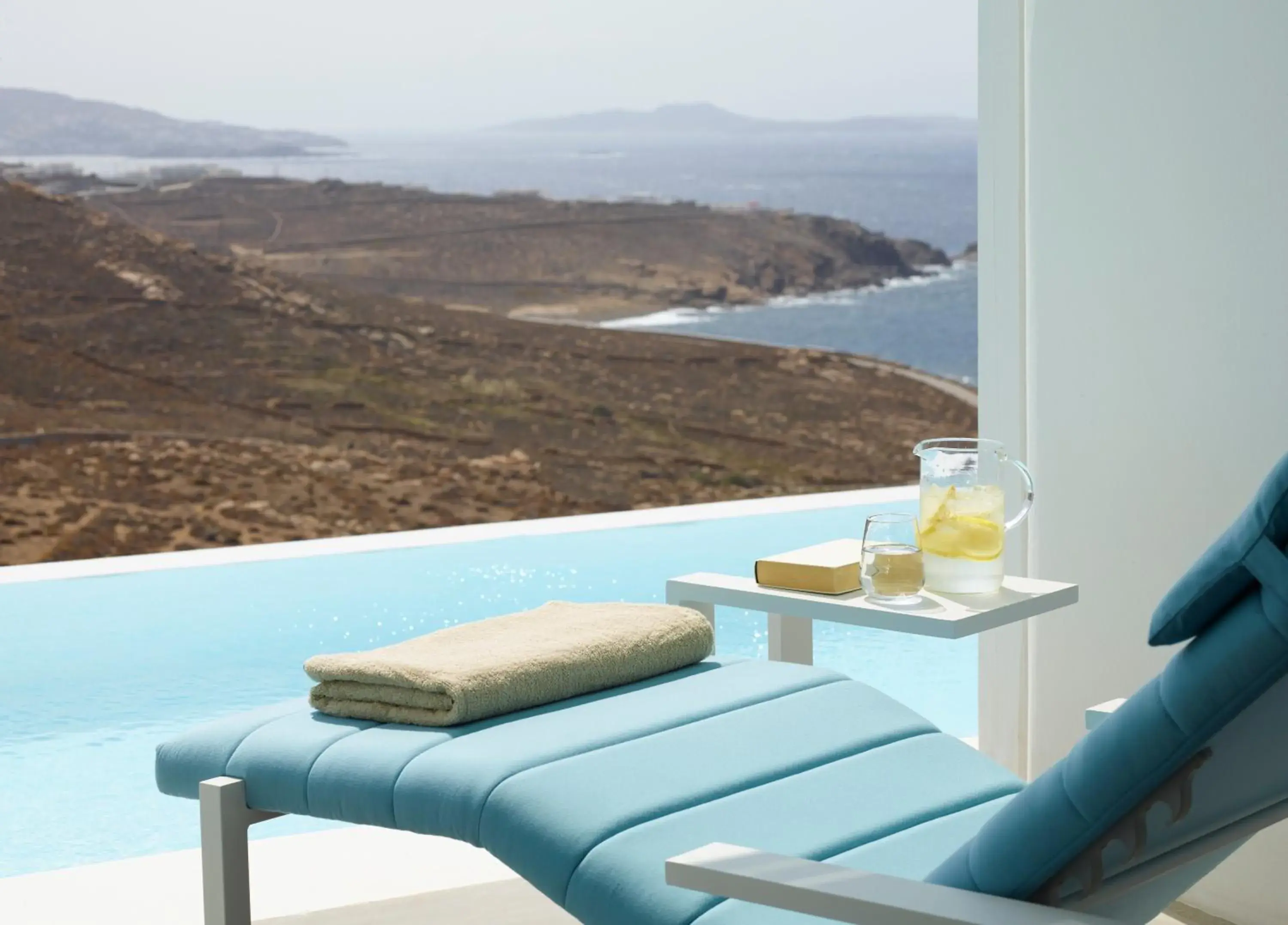 Deluxe Suite with Sharing Pool Sea View in Epic Blue Mykonos Deluxe Suite with Sharing Pool Sea View in Epic Blue Mykonos