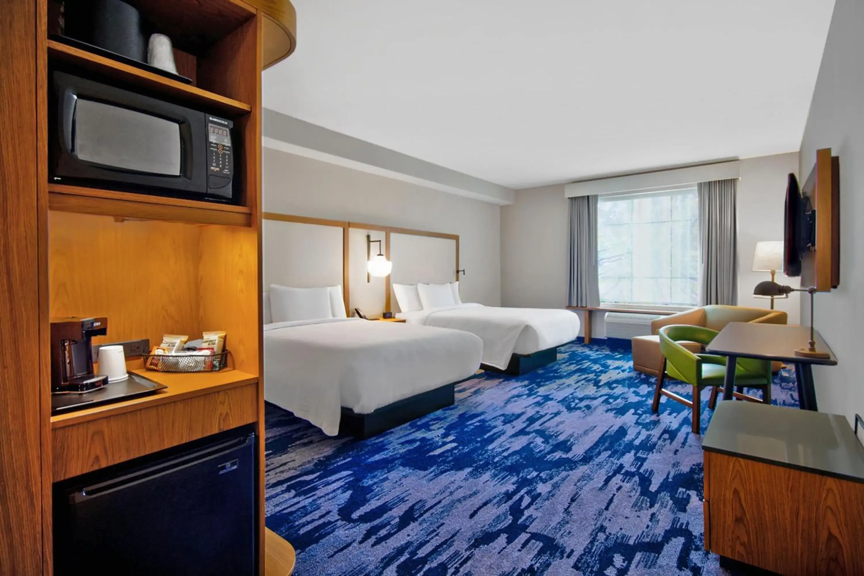 Larger Corner Guest room with 2 Queen in Fairfield by Marriott Inn & Suites Orlando at FLAMINGO CROSSINGS® Town Center Larger Corner Guest room with 2 Queen in Fairfield by Marriott Inn & Suites Orlando at FLAMINGO CROSSINGS® Town Center