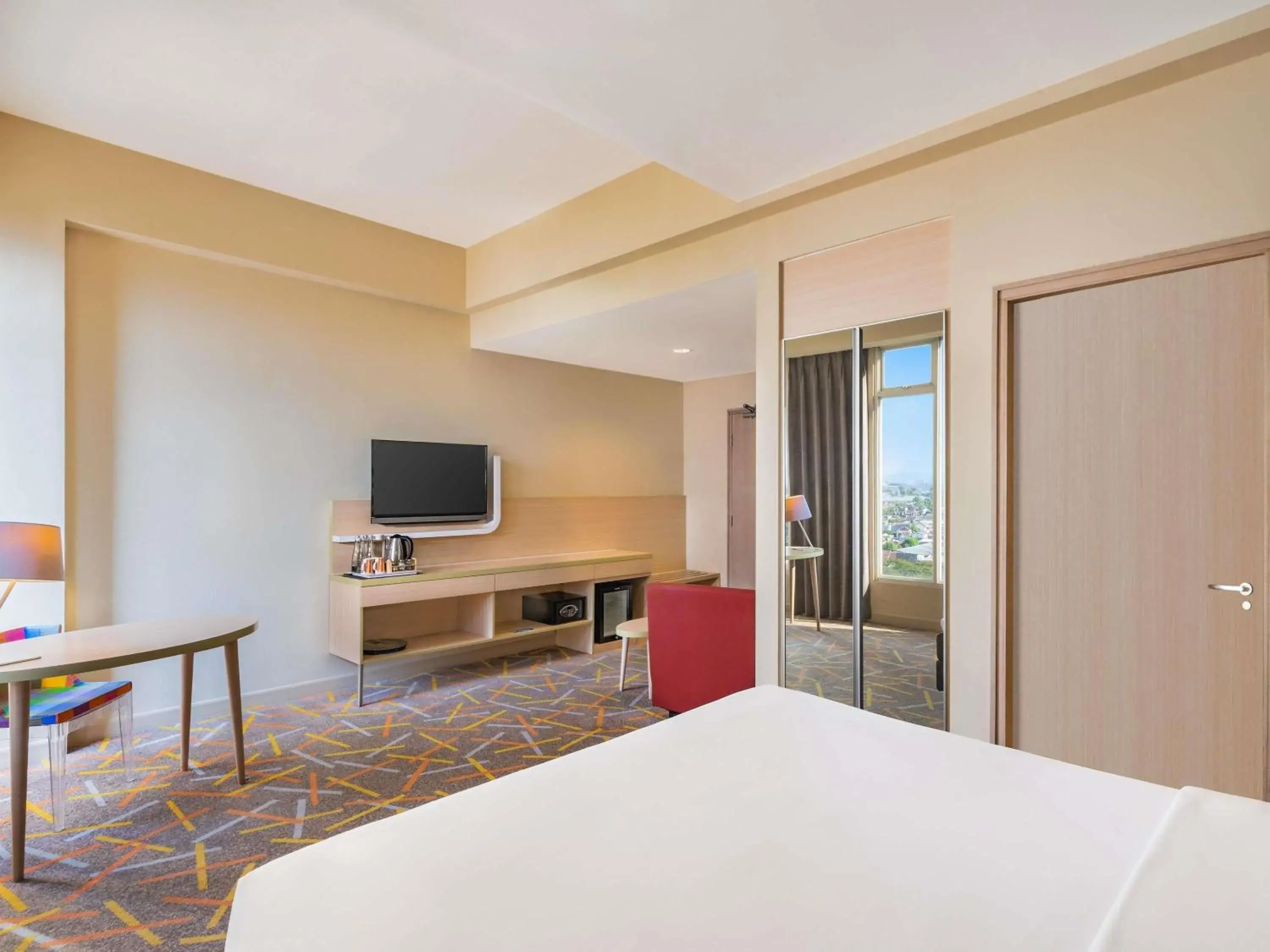 Deluxe King Room with Sofa in Ibis Styles Malang Deluxe King Room with Sofa in Ibis Styles Malang