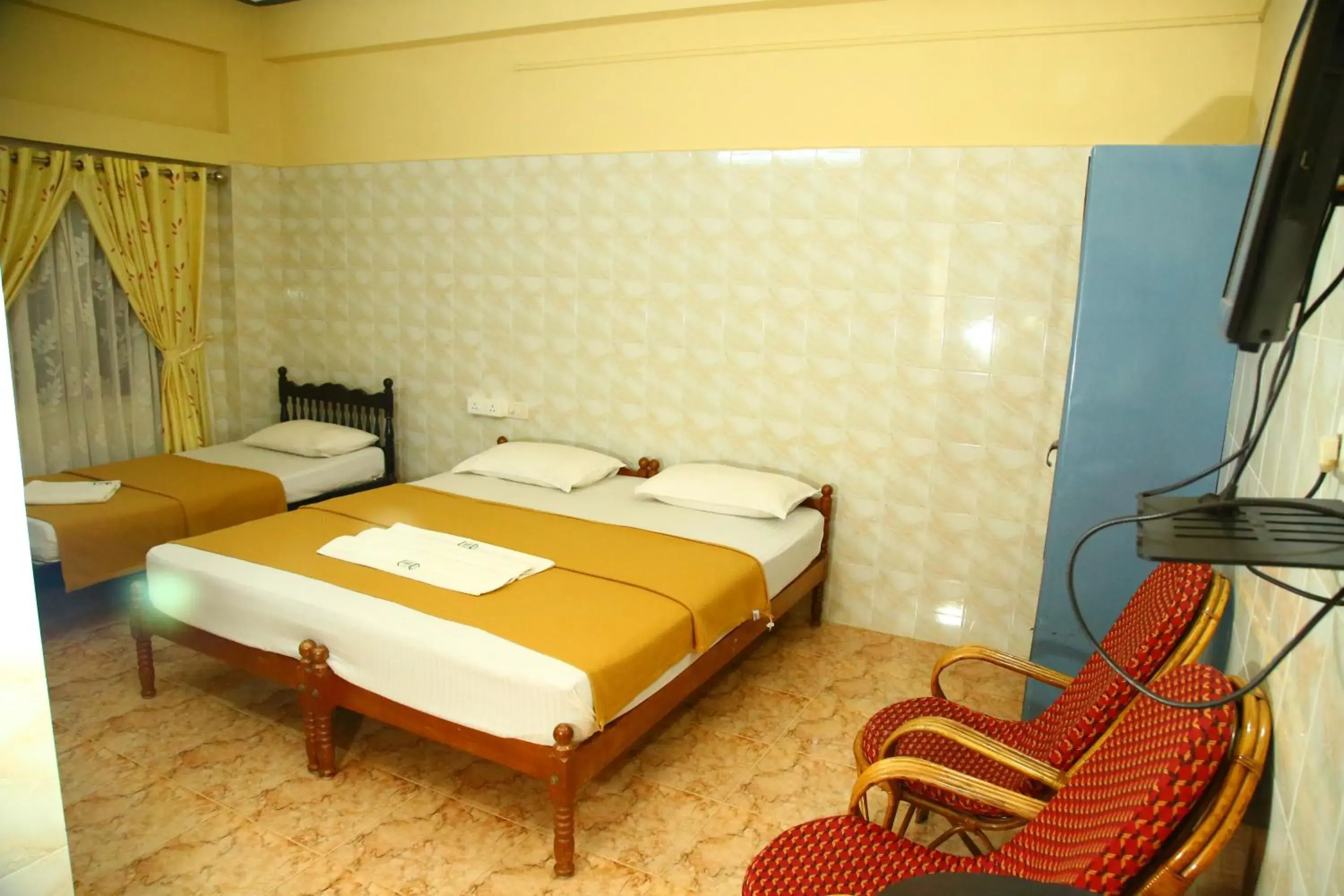 Deluxe Triple Room in Lake Palace Family Resort Kumarakom Deluxe Triple Room in Lake Palace Family Resort Kumarakom