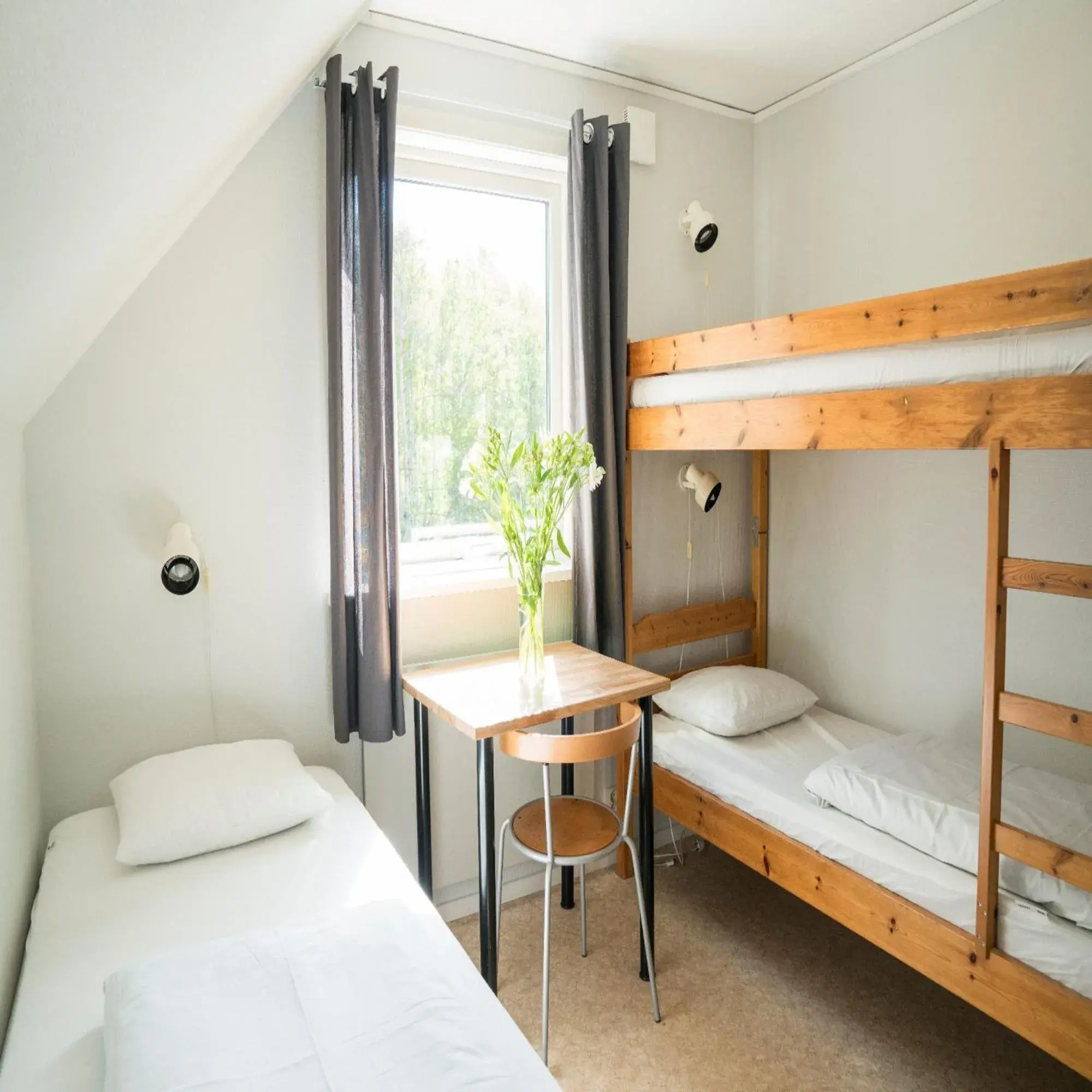 Economy Triple Room with Shared Bathroom - single occupancy in Hotell Solstickan Economy Triple Room with Shared Bathroom - single occupancy in Hotell Solstickan