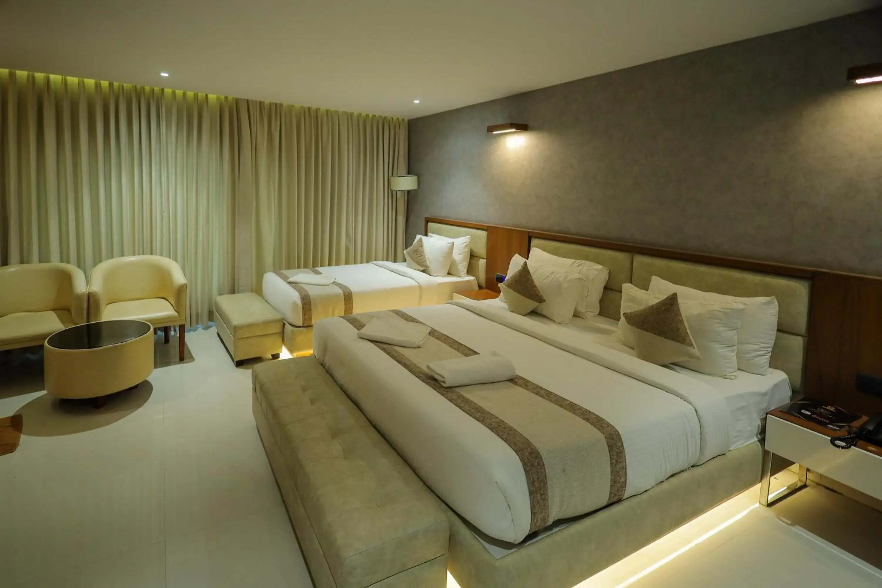 Deluxe Triple Room - single occupancy in Royal Plaza Suites by RAK Rooms, Mangaluru Deluxe Triple Room - single occupancy in Royal Plaza Suites by RAK Rooms, Mangaluru