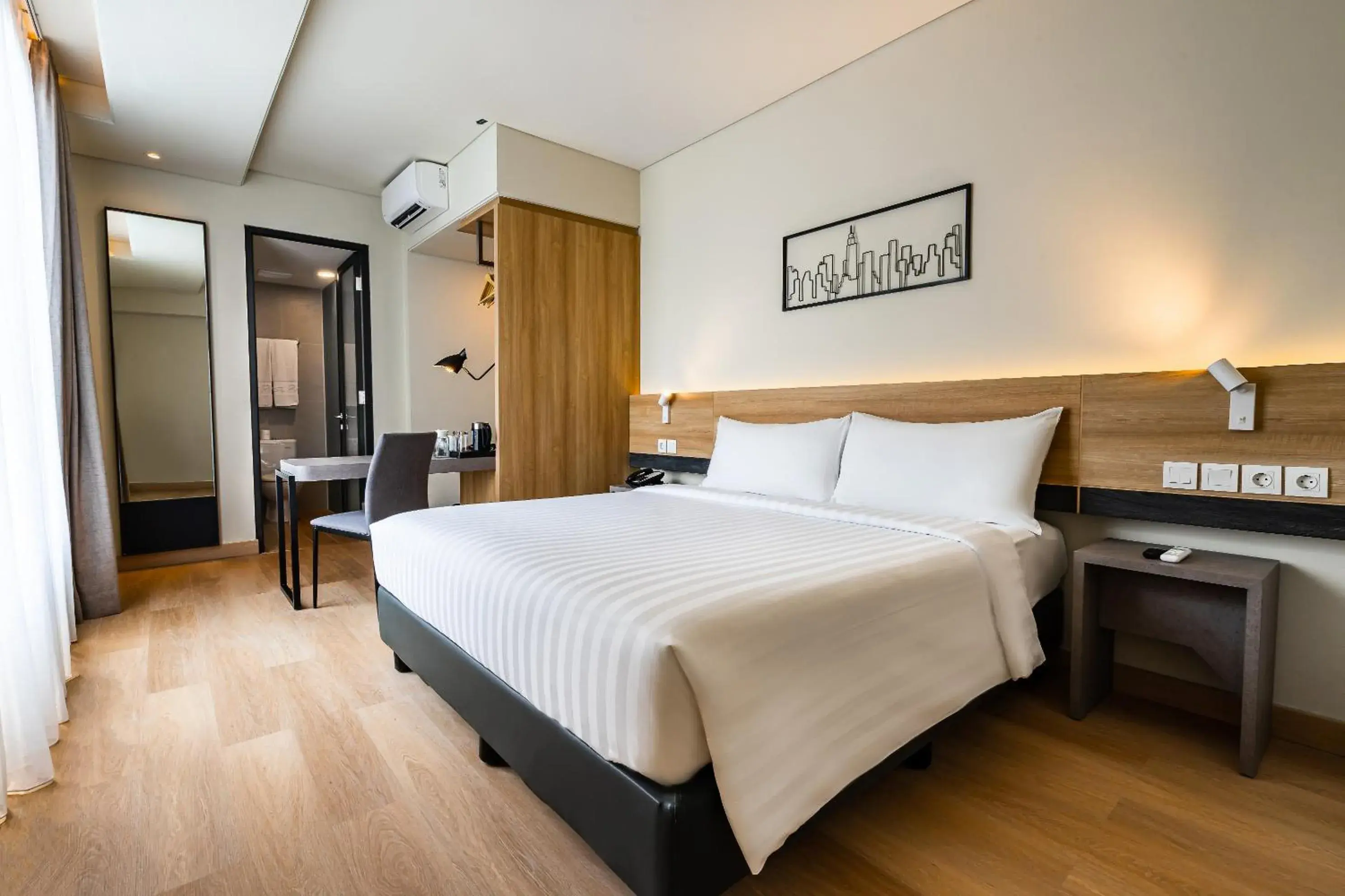 Deluxe Room in Quest Prime Pemuda - Semarang Deluxe Room in Quest Prime Pemuda - Semarang