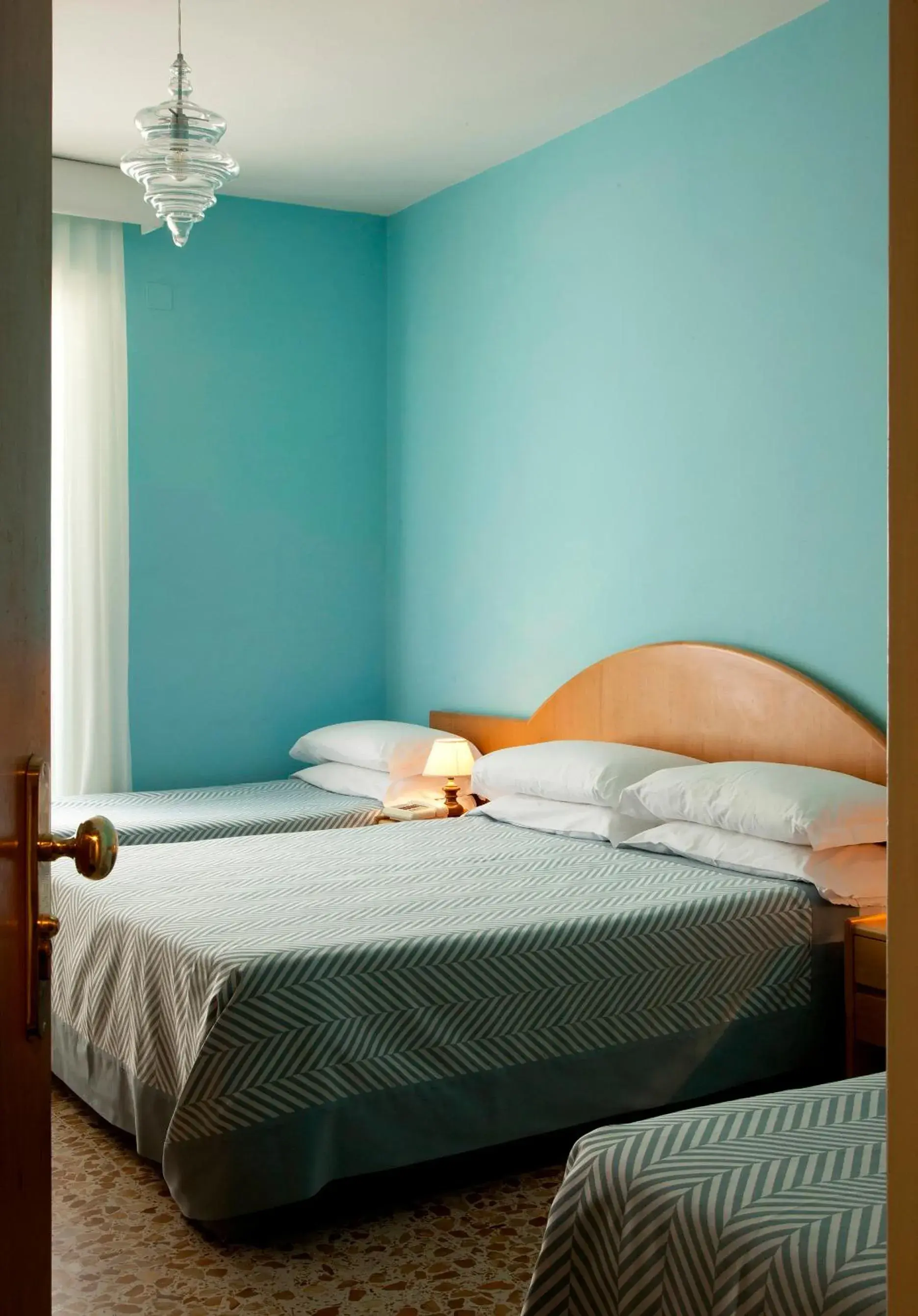 Quadruple Room in Hotel Del Corso Quadruple Room in Hotel Del Corso