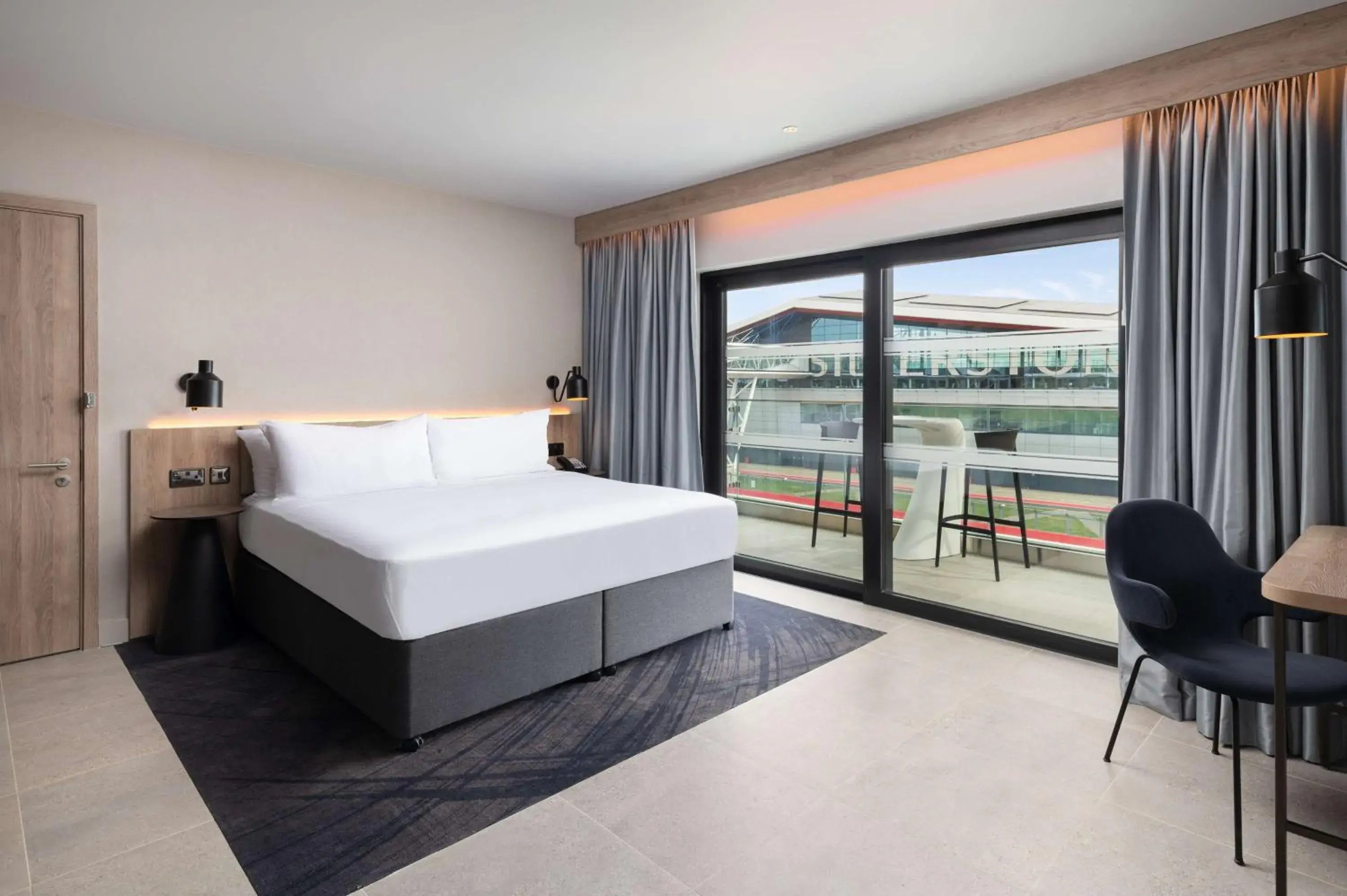 One Bedroom Suite with One King Bed and Balcony - Track Facing in Hilton Garden Inn Silverstone One Bedroom Suite with One King Bed and Balcony - Track Facing in Hilton Garden Inn Silverstone