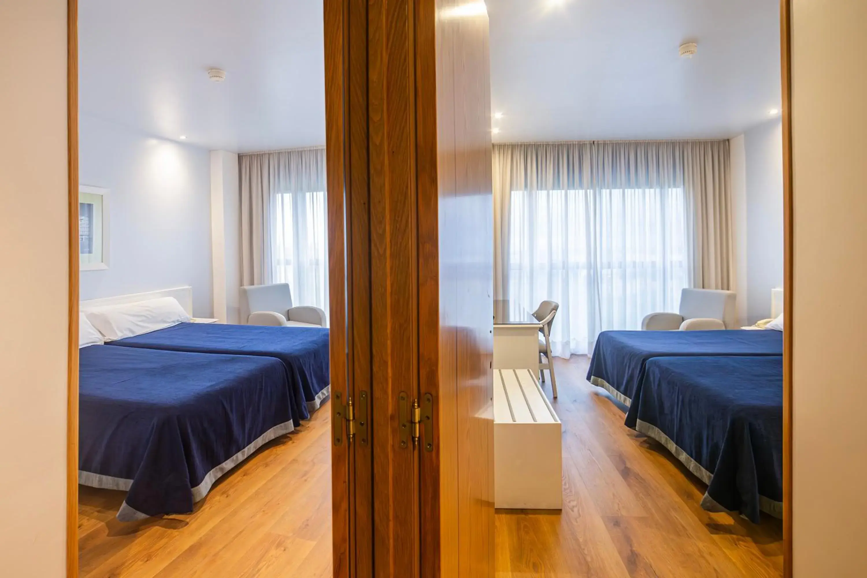 Quadruple Room (2 Adults + 2 Children) in Hotel Auditorio Santiago & Spa Quadruple Room (2 Adults + 2 Children) in Hotel Auditorio Santiago & Spa