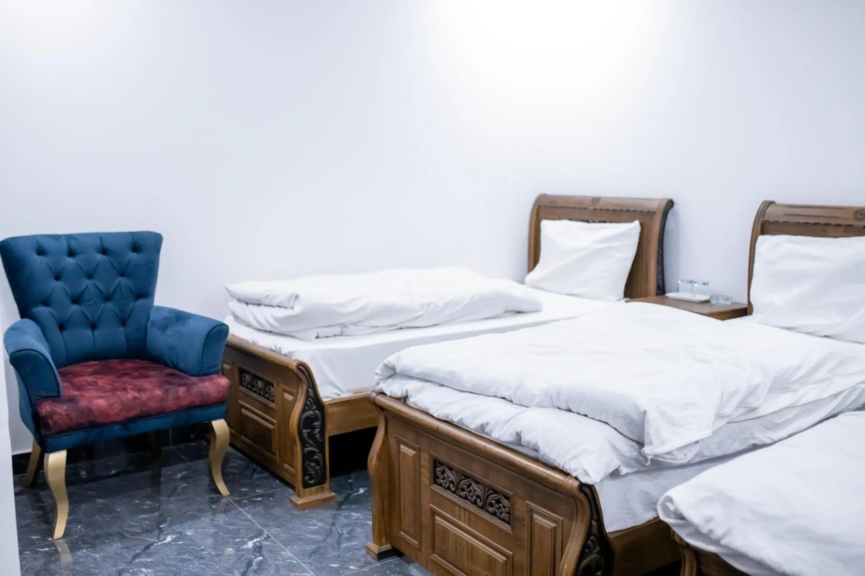 Economy Triple Room with Shared Bathroom in Regal Residency Economy Triple Room with Shared Bathroom in Regal Residency